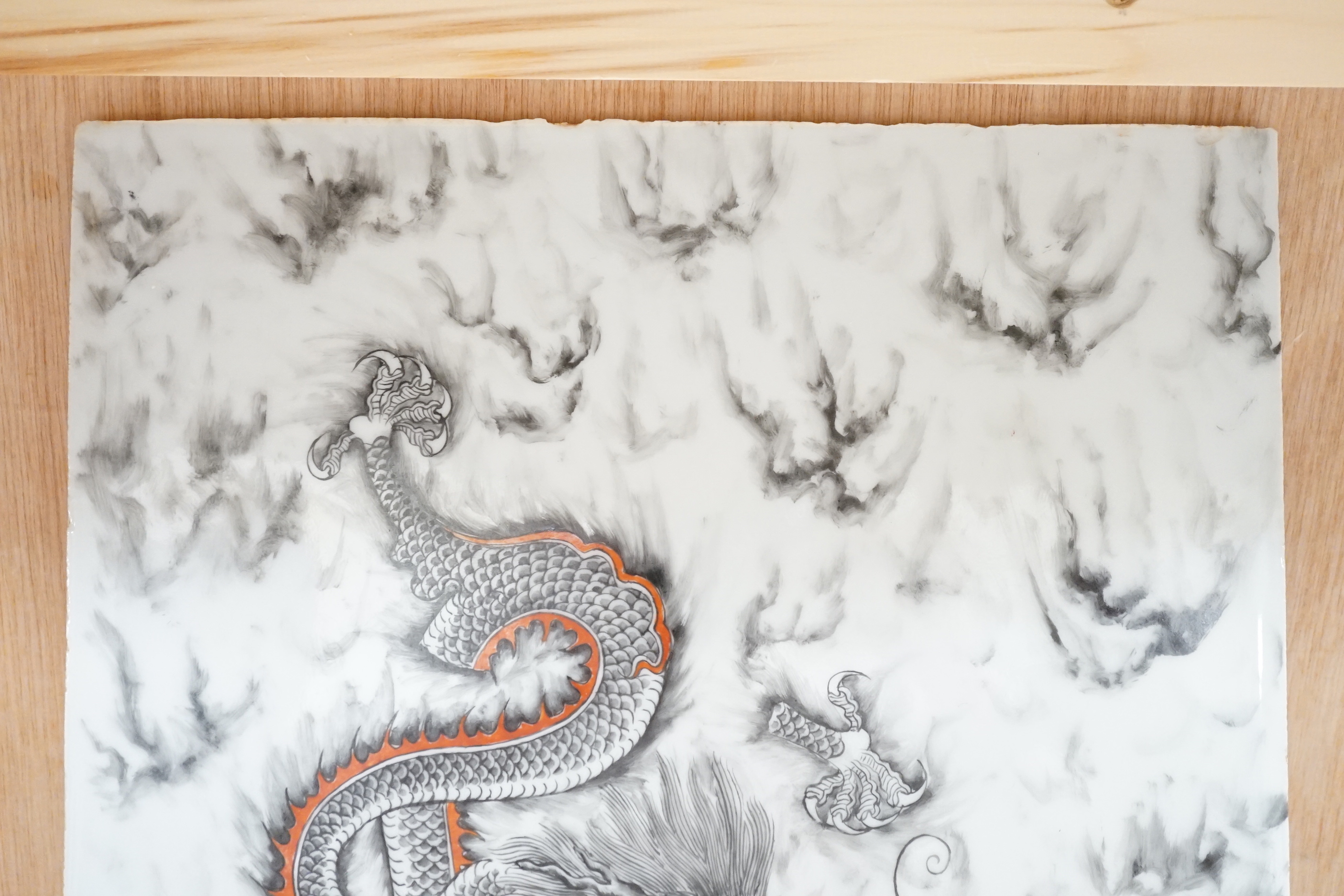 A Chinese porcelain rectangular dragon panel, 42cm x 26cm